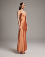 Liquid Silk Slipdress in Terracotta, featuring a bias cut and spaghetti straps.