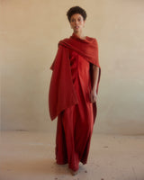 Model wearing a Solid Alpaca Duster in burnt orange, standing against a neutral background.