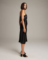 Model wearing a Bias Midi Skirt in Silk Charmeuse, side view