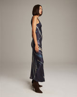 Model wearing a Midnight Double V Tie Dye Dress in profile view