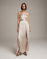 Model wearing a silver Frontward Wrap Dress, standing in a neutral background.