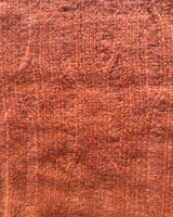 Close-up of ribbed fabric in Blood Orange color for Ribbed Cropped Sweater