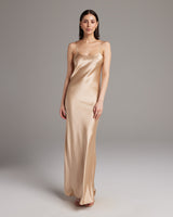 Model wearing a Liquid Silk Slipdress in a neutral tone