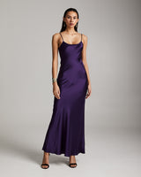 Model wearing a purple Liquid Silk Slipdress with spaghetti straps