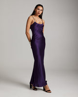 Model wearing a purple Liquid Silk Slipdress, showcasing its elegant design.