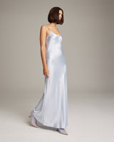 Model wearing a light blue Liquid Silk Slipdress with a bias cut