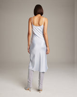 Back view of a light blue midi slip dress with spaghetti straps