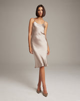 Model wearing a silver Midi Slip Dress with spaghetti straps