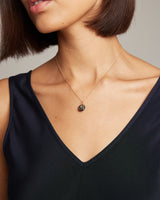 Model wearing Millapani Cuarzo Necklace, showcasing its design and fit.