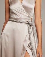 Model wearing a grey braided rope belt with a dress