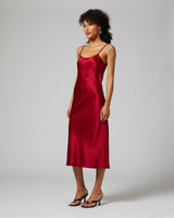 Ruby midi slip dress on model, showcasing elegant design and fit.