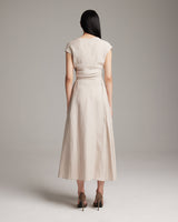 Back view of a model wearing a beige Linen Bralette Wrap Top