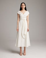 Model wearing a white Linen Bralette Wrap Top with long front sashes