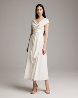 Model wearing a white Linen Bralette Wrap Top with long front sashes