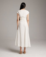 Model wearing a white Linen Bralette Wrap Top, back view