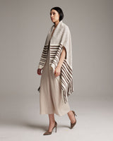 Model wearing the Petite Cascade Wrap in ivory and cafe, showcasing its design and texture.