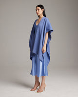 Model wearing a solid cotton duster over a blue slipdress