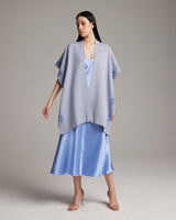 Model wearing a light blue Cotton Wangülen Duster over a satin dress