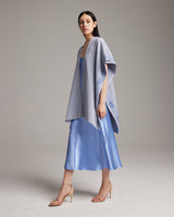 Model wearing a light blue Cotton Wangülen Duster with floral embroidery