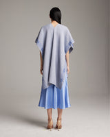 Model wearing a Cotton Wangülen Duster in light blue, showing back view