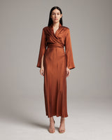 Model wearing a brown Silk Featherlight Wrap Blouse, showcasing its design and fit.