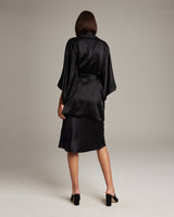Model wearing a black silk kimono from the back