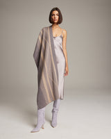 Model wearing a taupe Striped Zig Zag Shawl with a diagonal stripe pattern