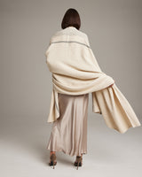 Model wearing a Wide Diagonal Alpaca Wrap in ivory, showcasing the back view.