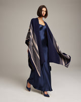 Model wearing a navy Striped Zig Zag Duster over a satin dress
