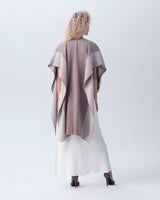 Model wearing a Striped Edge Caftan in Cotton from the back, showcasing its design and color.