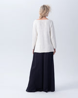Back view of a white Cotton Flammé Relaxed Sweater with long sleeves