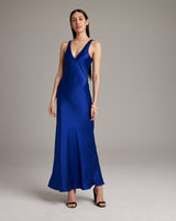 Model wearing a blue Double V Slip Dress made of sandwashed silk