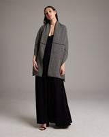 Model wearing Lineas Shawl in Baby Alpaca, showcasing its texture and design