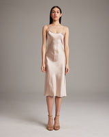 Blush Midi Slip Dress in silk charmeuse, elegantly draping on the body.