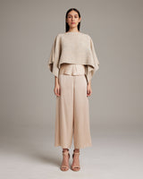 Model wearing a beige Pearl Crop Top with wide sleeves and matching pants