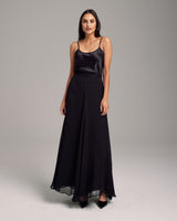 Model wearing a black Crinkle Chiffon Double Layer Skirt with a satin top
