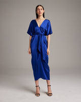 Model wearing a sapphire blue kaftan dress made of sand-washed silk