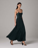 Model wearing a dark green Crinkle Chiffon Double Layer Skirt, showcasing its flow and design.
