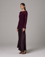 Model wearing a burgundy Open Mesh Boatneck Sweater with a long satin skirt
