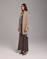 Model wearing Raiz Shawl in Baby Alpaca, showcasing its design and texture.