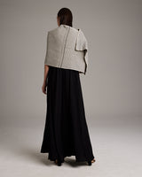 Model wearing Lineas Shawl in Baby Alpaca, showing back view and design details
