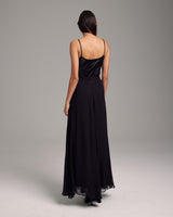 Back view of a model wearing a black Crinkle Chiffon Double Layer Skirt