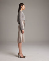 Model wearing a Painted Loose Knit Cropped Sweater in profile view