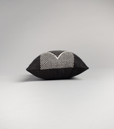 Side view of a black Diamante square pillow with a textured pattern