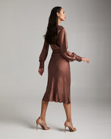 Model wearing a Bias Midi Skirt in Cupro Rayon, showing the back view