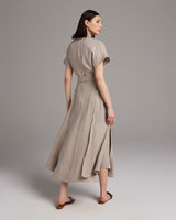 Back view of a taupe Butterfly Wrap Dress in Linen, featuring a flowing silhouette and side slits.