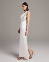 Model wearing a bridal convertible halter dress in ivory, showcasing a sleek design and side slit.