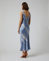 Back view of a blue tie dye double V slipdress on a model