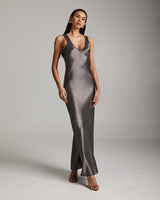Model wearing a long double V slip dress in silver mink