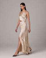 Model wearing a Frontward Wrap Dress in a light color, showcasing its elegant design and silhouette.